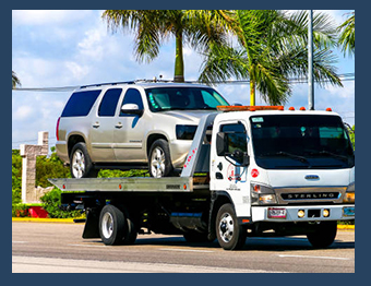Image of SUV on tow truck. SRS offers repossession services, vehicle remarketing and title management services. 